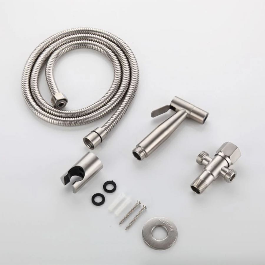 The stainless steel hand held bidet kit laid out: sprayer, braided hose, T-valve, holder and fixings